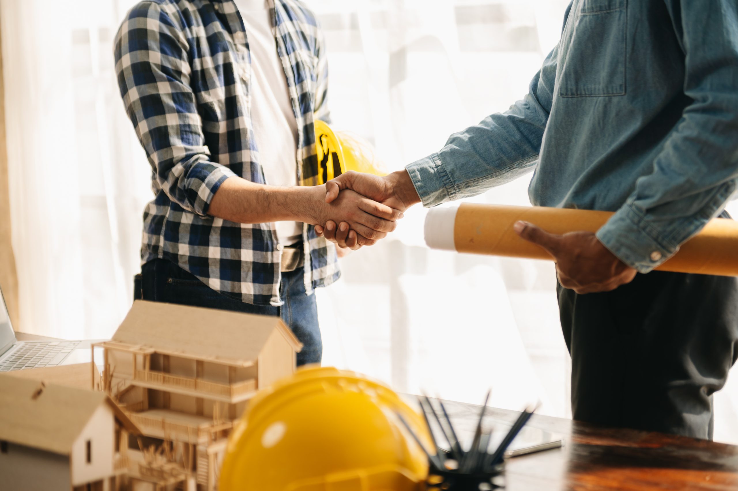 engineer teams meeting working together wear worker helmets hardhat on construction site in modern city.asian industry professional team.