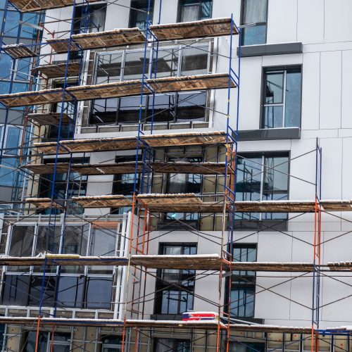 scaffolding around incomplete apartment building